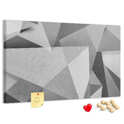 Pizarra de corcho con diseño de formas geométricas abstractas grises y negras