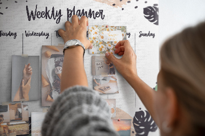 Pizarra de corcho con diseño de hojas tropicales para planificación semanal