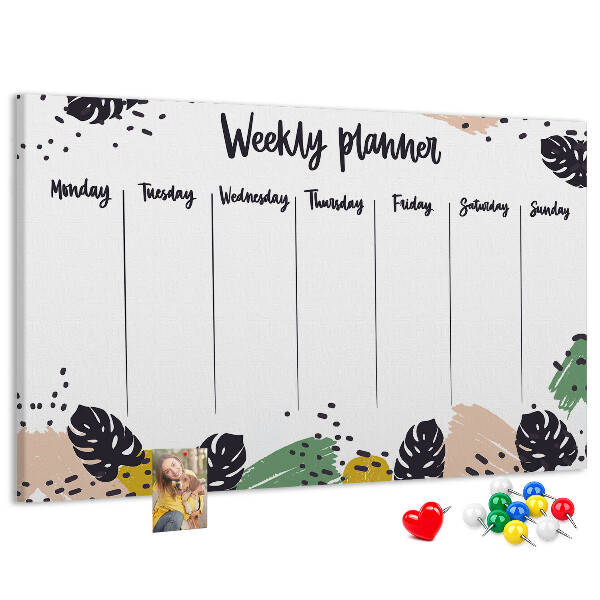 Pizarra de corcho con diseño de hojas tropicales para planificación semanal