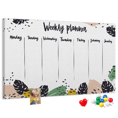 Pizarra de corcho con diseño de hojas tropicales para planificación semanal