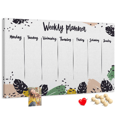 Pizarra de corcho con diseño de hojas tropicales para planificación semanal