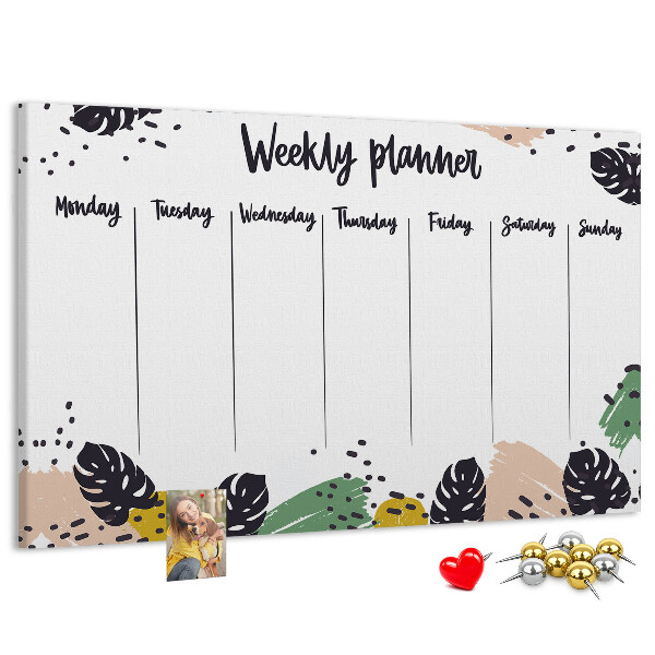 Pizarra de corcho con diseño de hojas tropicales para planificación semanal