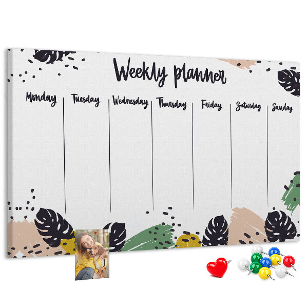Pizarra de corcho con diseño de hojas tropicales para planificación semanal