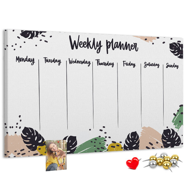 Pizarra de corcho con diseño de hojas tropicales para planificación semanal