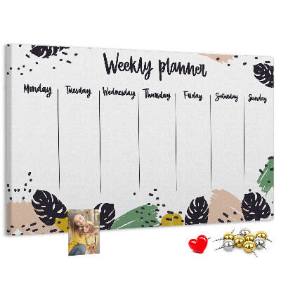 Pizarra de corcho con diseño de hojas tropicales para planificación semanal