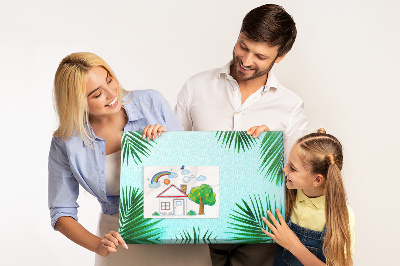 Pizarra de corcho con diseño de hojas tropicales sobre fondo azul