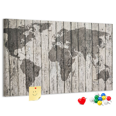 Tablero de corcho decorado Un mapamundi sobre un fondo de tablas de madera.