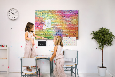 Tablero de corcho decorativo con diseño de muro de ladrillos coloridos en arcoíris