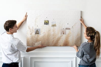 Tablero de corcho decorativo con diseño de hierbas delicadas sobre fondo claro