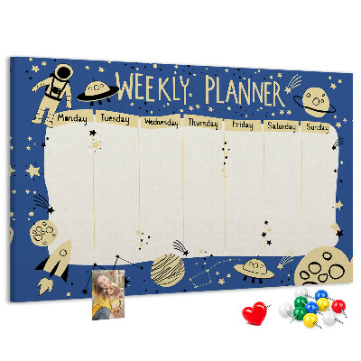 Tablero de corcho decorado planificador semanal con diseño de planetas y estrellas