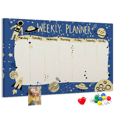 Tablero de corcho decorado planificador semanal con diseño de planetas y estrellas