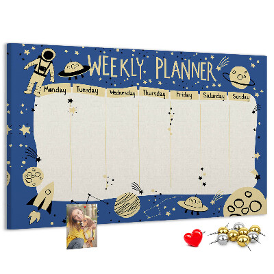 Tablero de corcho decorado planificador semanal con diseño de planetas y estrellas