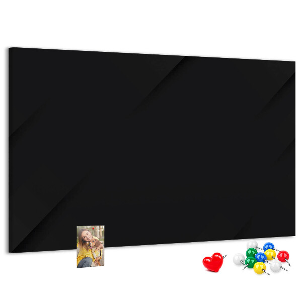 Pizarra de corcho con marco negro y chinchetas de colores