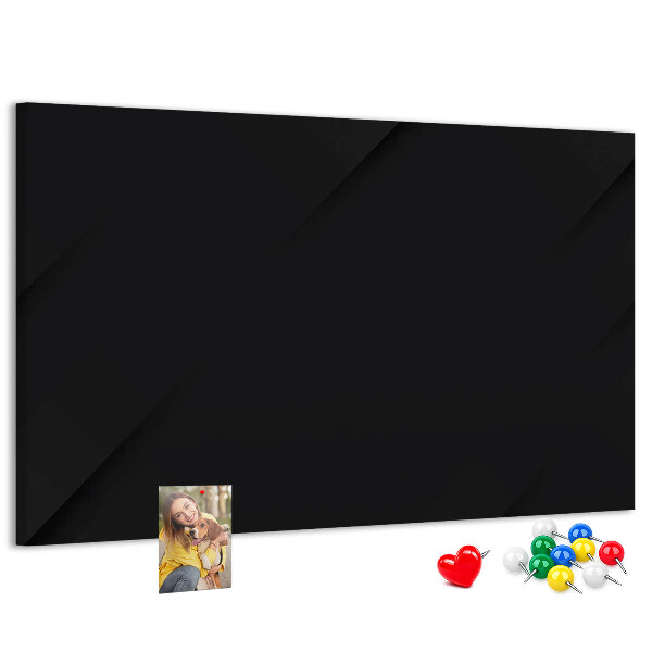 Pizarra de corcho con marco negro y chinchetas de colores