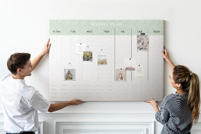 Pizarra de corcho con diseño de plan semanal y secciones claras