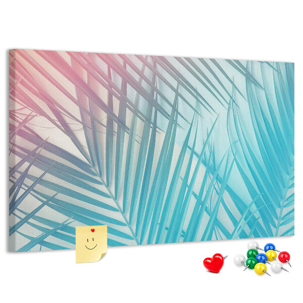 Pizarra de corcho con diseño de hojas tropicales sobre fondo pastel