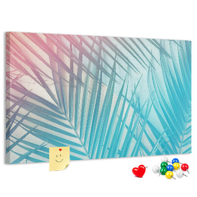 Pizarra de corcho con diseño de hojas tropicales sobre fondo pastel