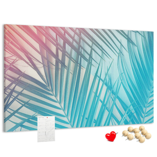 Pizarra de corcho con diseño de hojas tropicales sobre fondo pastel