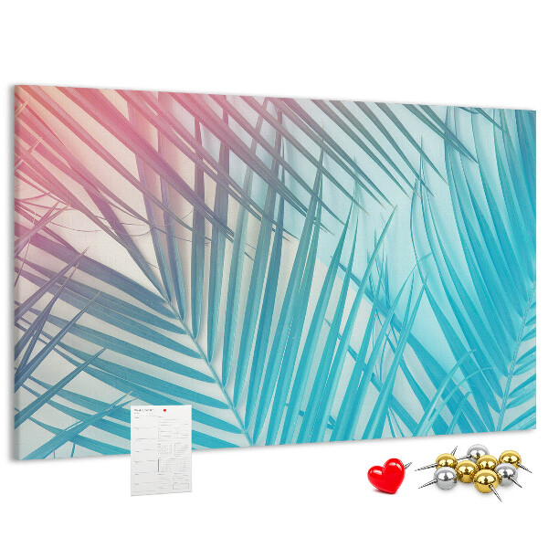 Pizarra de corcho con diseño de hojas tropicales sobre fondo pastel