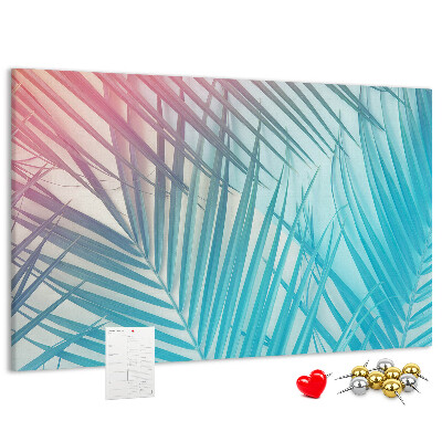 Pizarra de corcho con diseño de hojas tropicales sobre fondo pastel