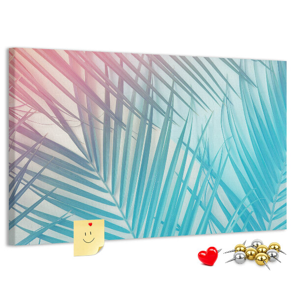Pizarra de corcho con diseño de hojas tropicales sobre fondo pastel