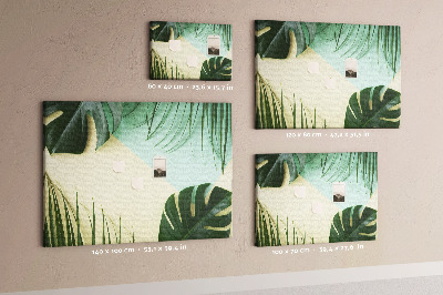 Tablero de corcho decorativo con diseño de hojas tropicales sobre fondo pastel
