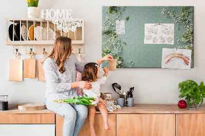 Tablero de anuncios con estampado floral sobre fondo verde