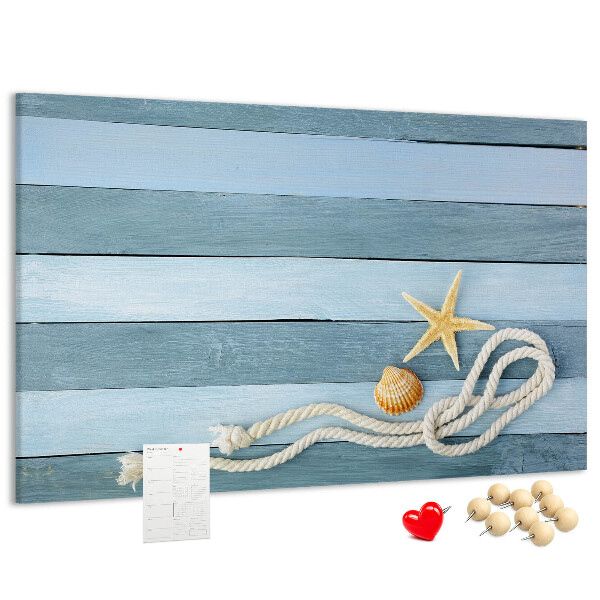Pizarra de corcho con diseño de paisaje marino con conchas y cuerda