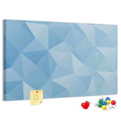 Pizarra de corcho con diseño de triángulos geométricos en tonalidades azules