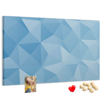 Pizarra de corcho con diseño de triángulos geométricos en tonalidades azules