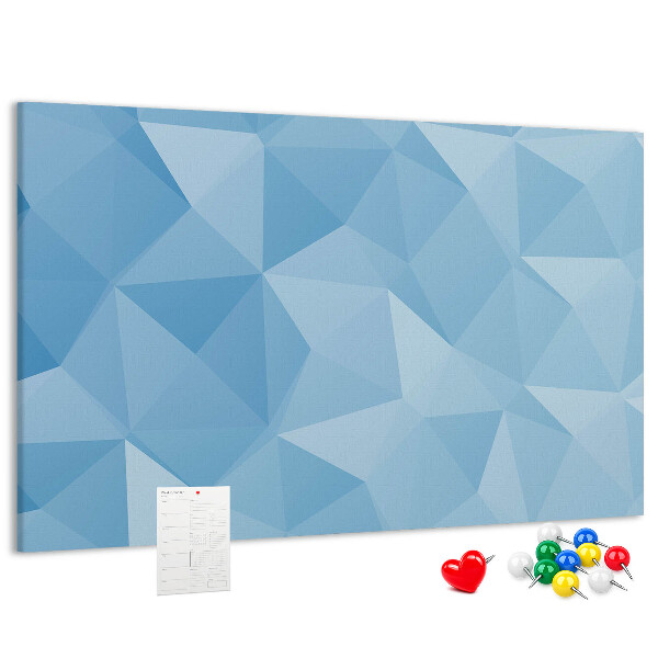 Pizarra de corcho con diseño de triángulos geométricos en tonalidades azules