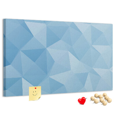 Pizarra de corcho con diseño de triángulos geométricos en tonalidades azules