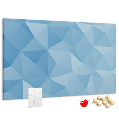 Pizarra de corcho con diseño de triángulos geométricos en tonalidades azules