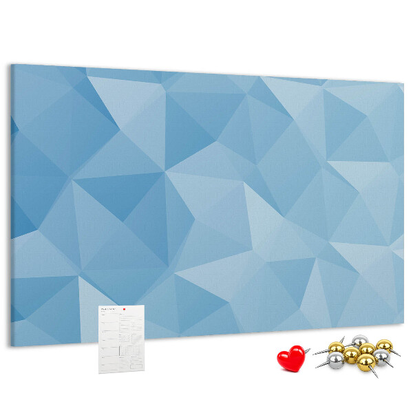 Pizarra de corcho con diseño de triángulos geométricos en tonalidades azules