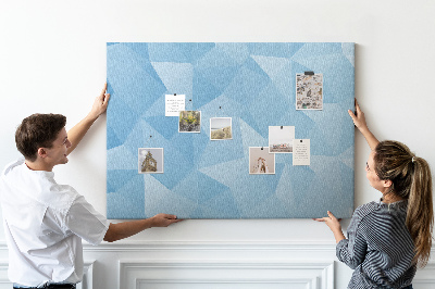 Pizarra de corcho con diseño de triángulos geométricos en tonalidades azules