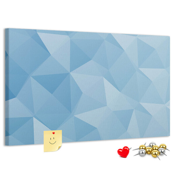 Pizarra de corcho con diseño de triángulos geométricos en tonalidades azules