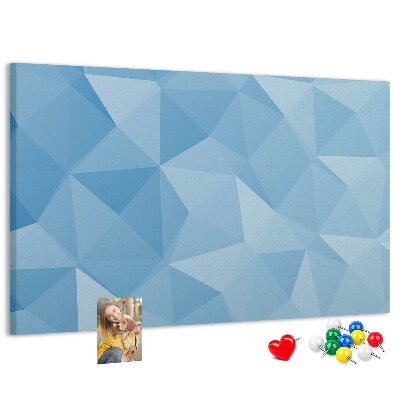 Pizarra de corcho con diseño de triángulos geométricos en tonalidades azules