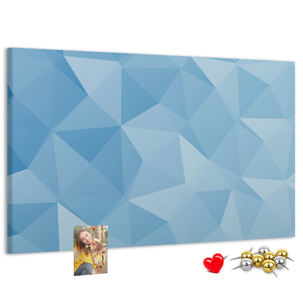 Pizarra de corcho con diseño de triángulos geométricos en tonalidades azules