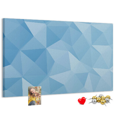Pizarra de corcho con diseño de triángulos geométricos en tonalidades azules