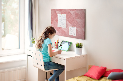 Pizarra de corcho con diseño geométrico en tonos rosas y beige