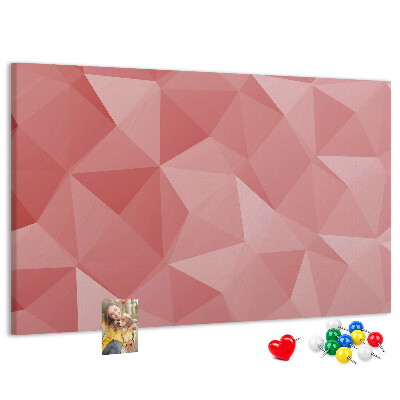 Pizarra de corcho con diseño geométrico en tonos rosas y beige