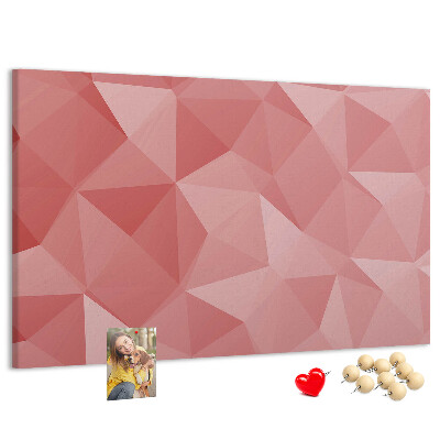 Pizarra de corcho con diseño geométrico en tonos rosas y beige