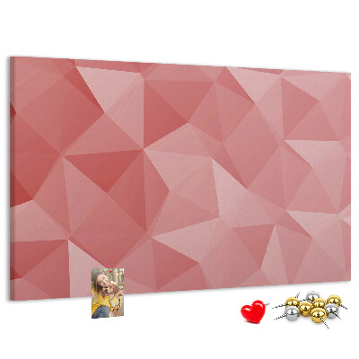 Pizarra de corcho con diseño geométrico en tonos rosas y beige