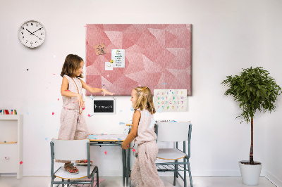Pizarra de corcho con diseño geométrico en tonos rosas y beige