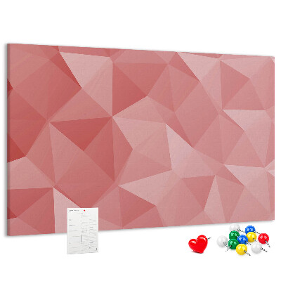Pizarra de corcho con diseño geométrico en tonos rosas y beige