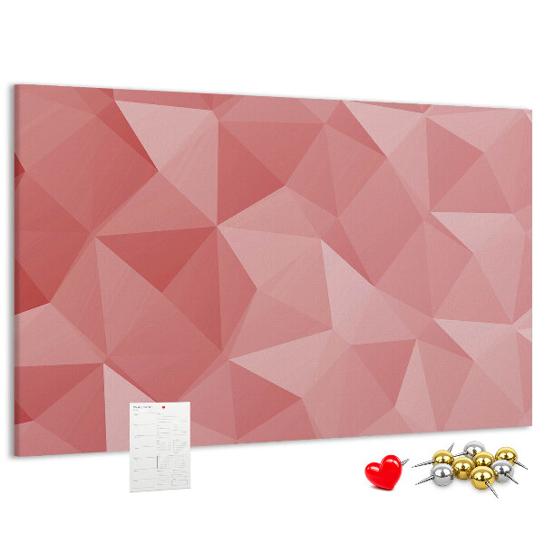 Pizarra de corcho con diseño geométrico en tonos rosas y beige