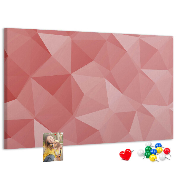 Pizarra de corcho con diseño geométrico en tonos rosas y beige