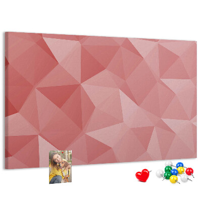 Pizarra de corcho con diseño geométrico en tonos rosas y beige