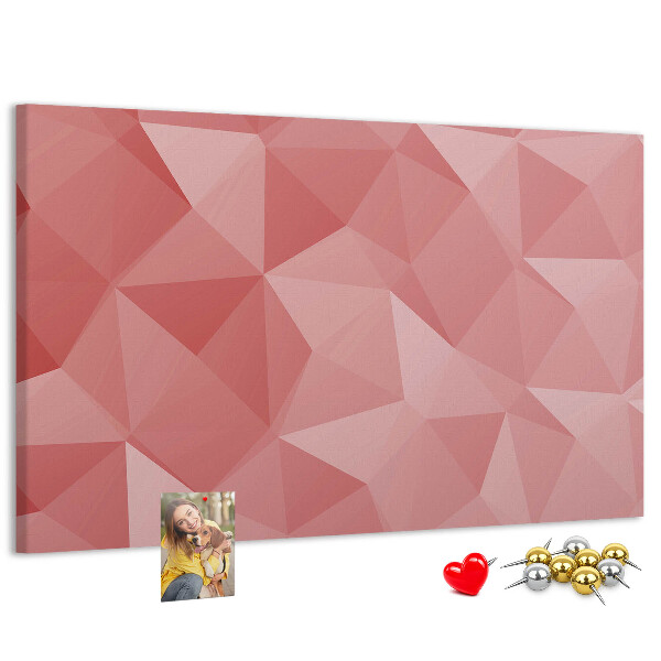 Pizarra de corcho con diseño geométrico en tonos rosas y beige