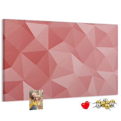 Pizarra de corcho con diseño geométrico en tonos rosas y beige